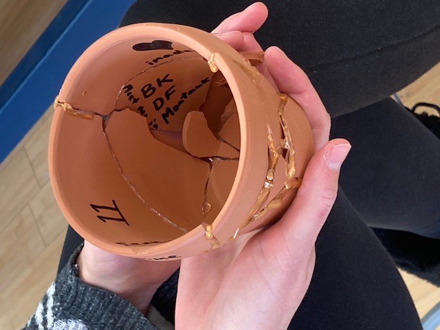a kintsugi pot in the process of being decorated